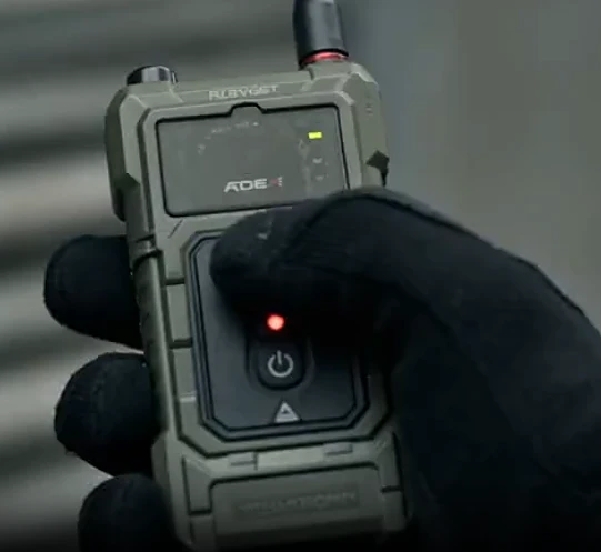 Special forces operator pressing breaching detonation button reference