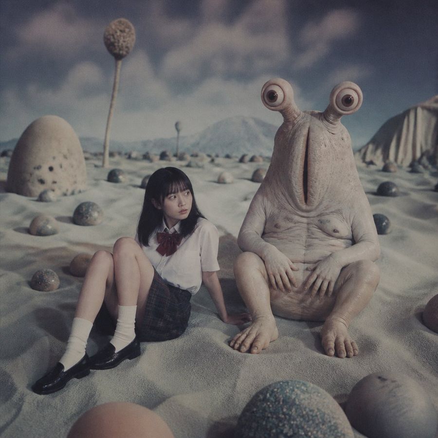 Schoolgirl and Eyestalk Alien in Sandy Wasteland