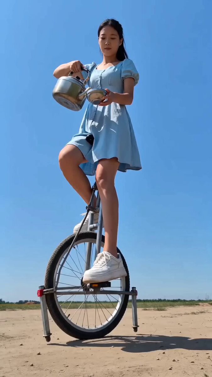 Tall Unicycle Tea Pouring Stunt